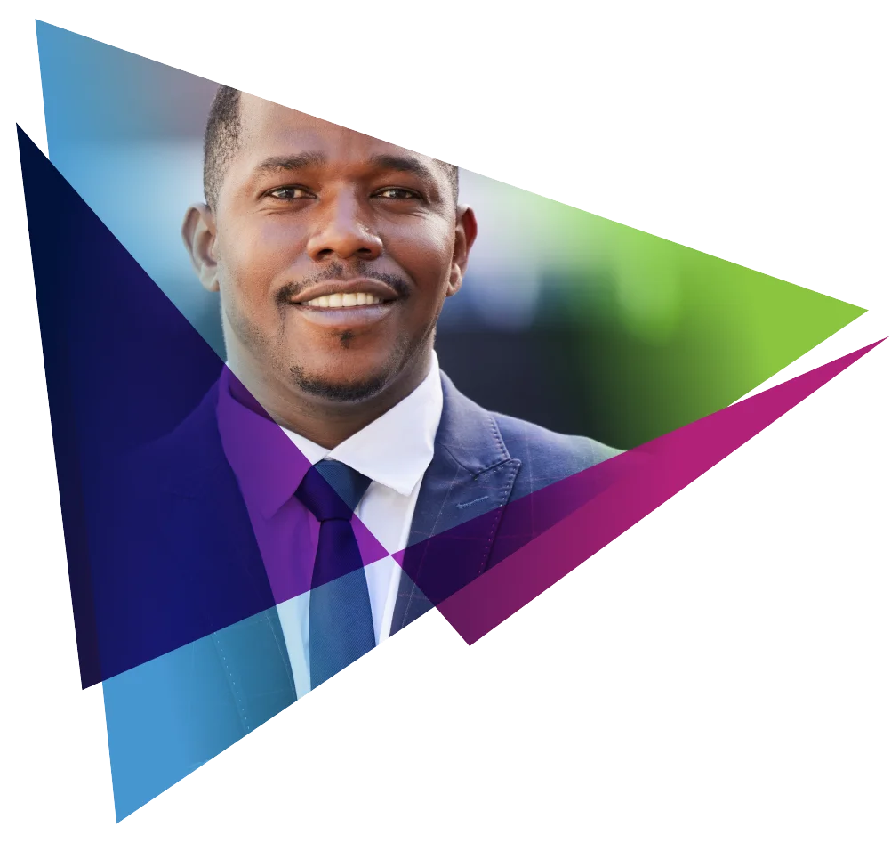 Smiling man in a suit framed by colorful triangular shapes.